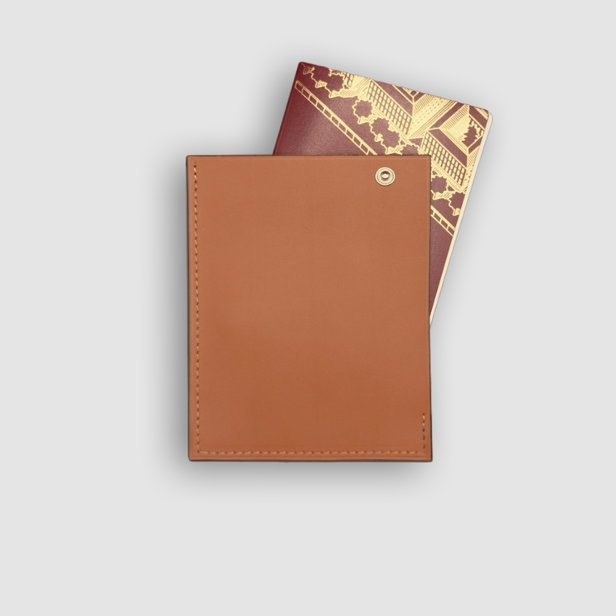 Passport holder in fauve baranil calf leather with passport sticking out